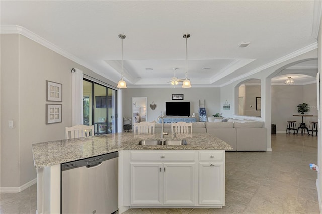 kitchen featuring white cabinetry, a center island with sink, a raised ceiling, dishwasher, and sink