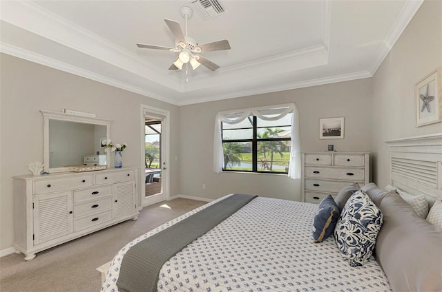 bedroom featuring light carpet, ceiling fan, a raised ceiling, and access to outside