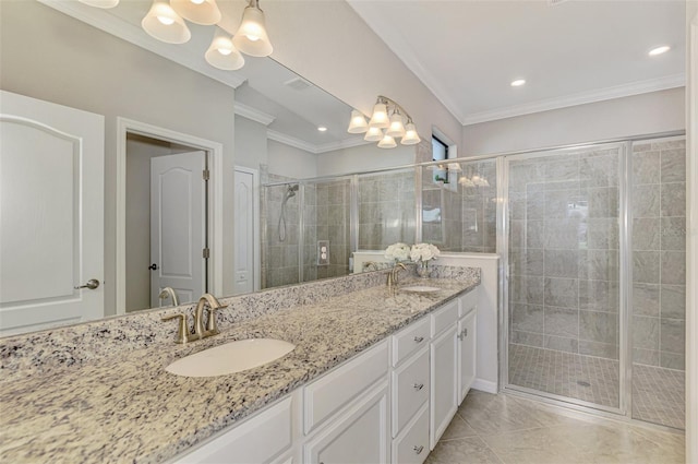 bathroom featuring vanity, a notable chandelier, a shower with door, and ornamental molding