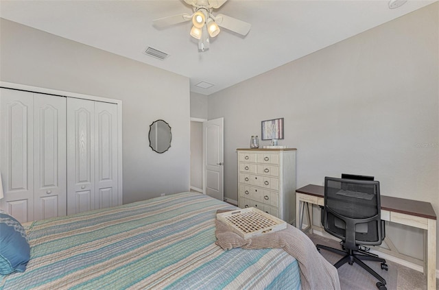 bedroom with ceiling fan and a closet