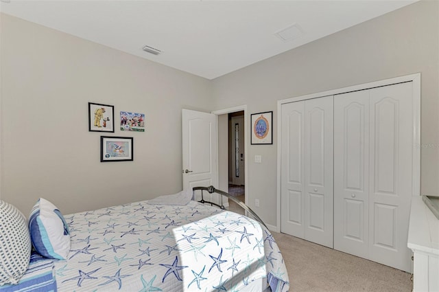 bedroom with light colored carpet and a closet