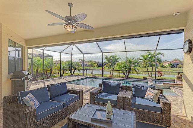 view of patio / terrace featuring a lanai, a grill, outdoor lounge area, and ceiling fan