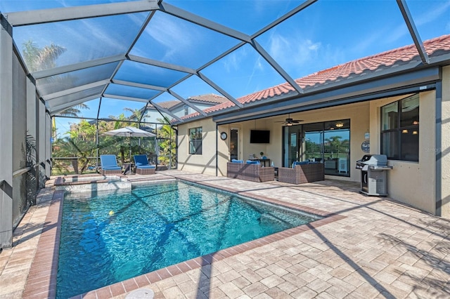 view of swimming pool featuring a patio area, outdoor lounge area, ceiling fan, a lanai, and area for grilling