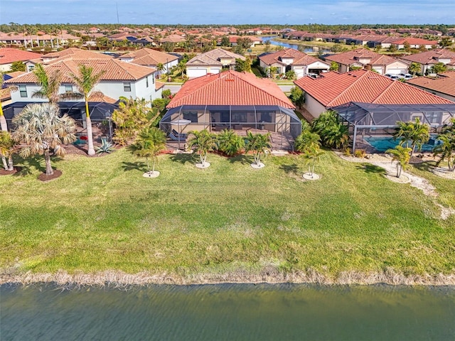 bird's eye view with a water view