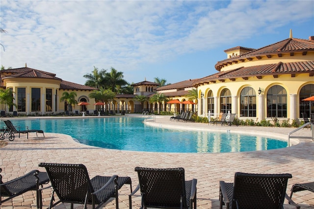 view of swimming pool with a patio