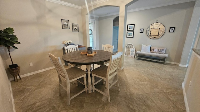 dining space with crown molding