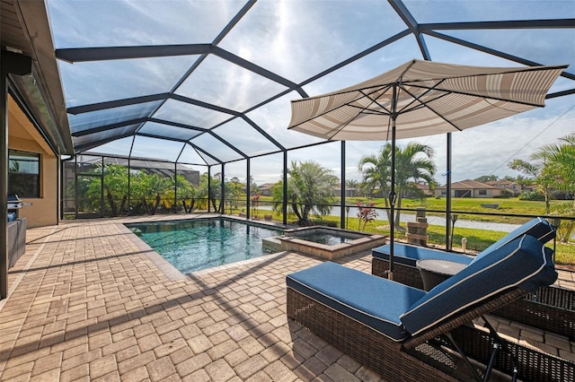 view of pool with an in ground hot tub, a water view, a patio, and glass enclosure