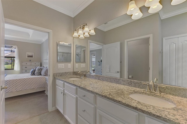 bathroom featuring tile patterned floors, ornamental molding, and vanity