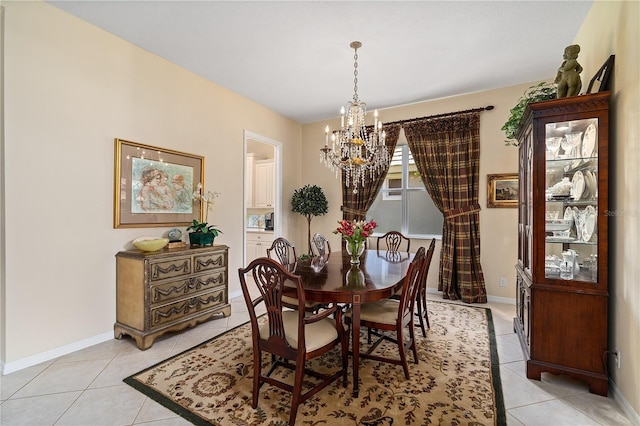 tiled dining area with an inviting chandelier