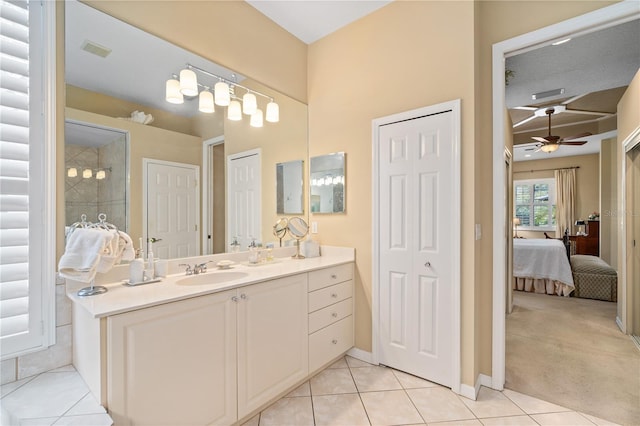 bathroom featuring tile patterned flooring, a textured ceiling, vanity, and ceiling fan