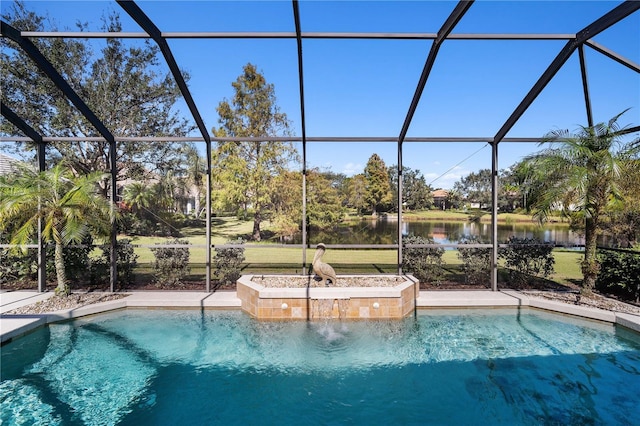 view of pool with a lanai, pool water feature, and a water view