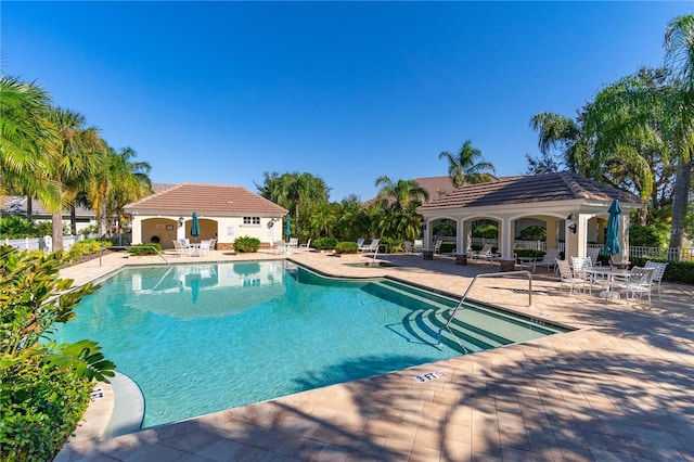 view of swimming pool with a patio