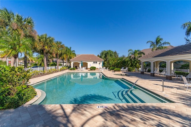 view of swimming pool with a patio area