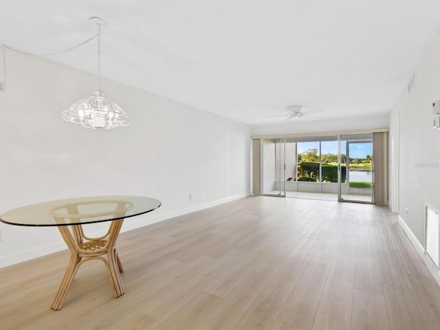 interior space with ceiling fan and light wood-type flooring