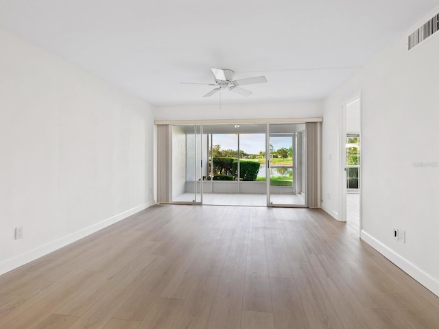 spare room featuring ceiling fan and light wood-type flooring