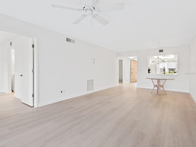 unfurnished living room with ceiling fan and light hardwood / wood-style floors