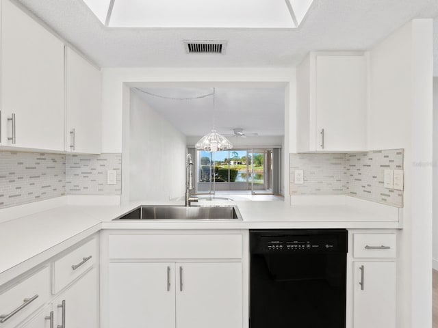 kitchen featuring dishwasher, white cabinets, and sink