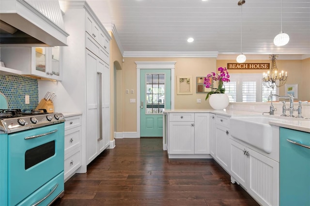 kitchen featuring white cabinets, custom exhaust hood, a healthy amount of sunlight, and stove