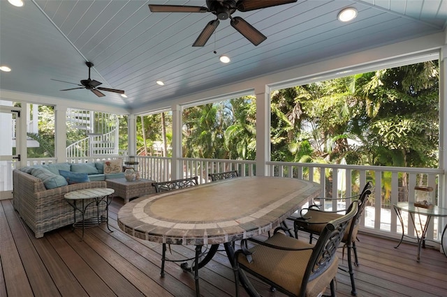 sunroom / solarium featuring ceiling fan, wooden ceiling, and vaulted ceiling