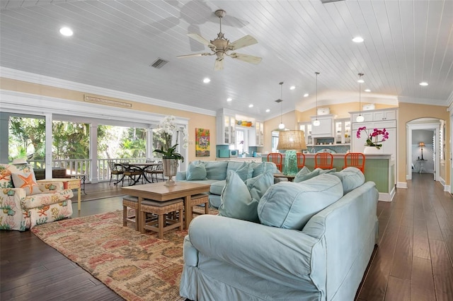 living room with dark wood-type flooring, crown molding, vaulted ceiling, ceiling fan, and wood ceiling