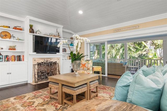 living room with crown molding, built in features, dark wood-type flooring, and vaulted ceiling