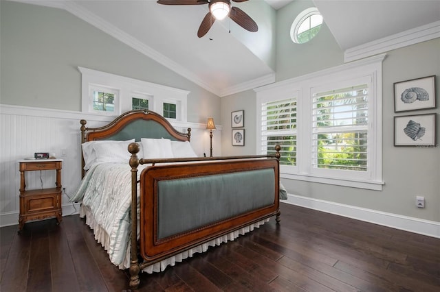 bedroom featuring ceiling fan, dark hardwood / wood-style floors, lofted ceiling, and ornamental molding