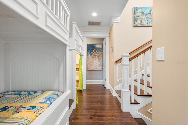 bedroom featuring dark hardwood / wood-style flooring and ornamental molding