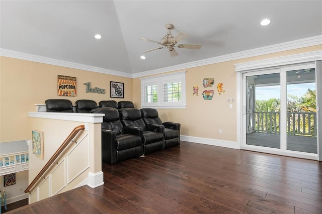 living room featuring ceiling fan, dark wood-type flooring, lofted ceiling, and ornamental molding