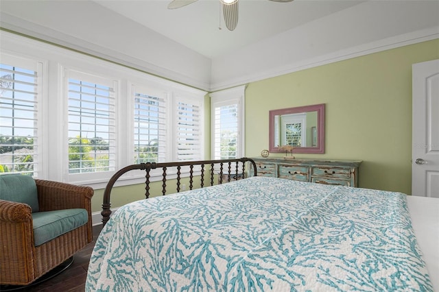 bedroom featuring multiple windows, ceiling fan, and hardwood / wood-style floors