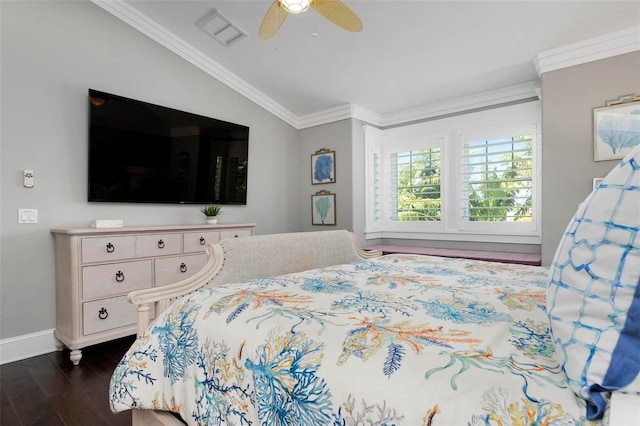 bedroom featuring ceiling fan, crown molding, dark wood-type flooring, and vaulted ceiling