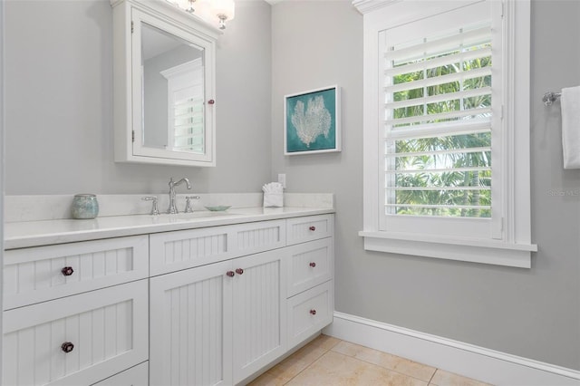 bathroom featuring tile patterned flooring and vanity