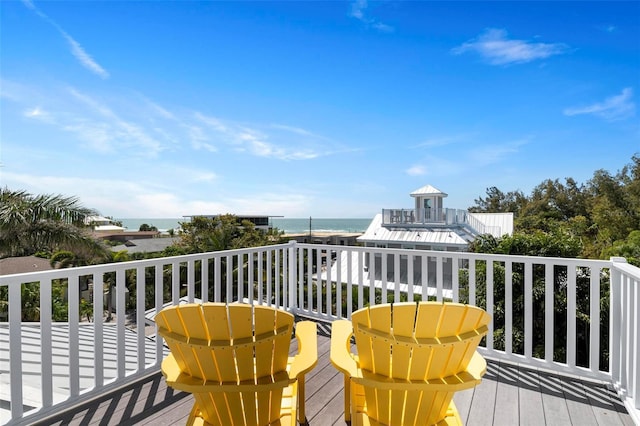 wooden deck featuring a water view