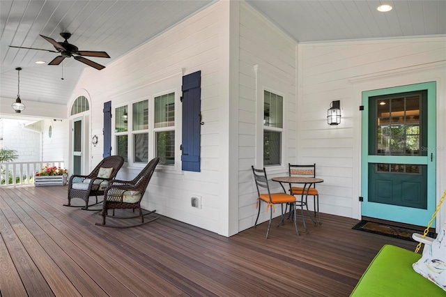 deck featuring ceiling fan and a porch