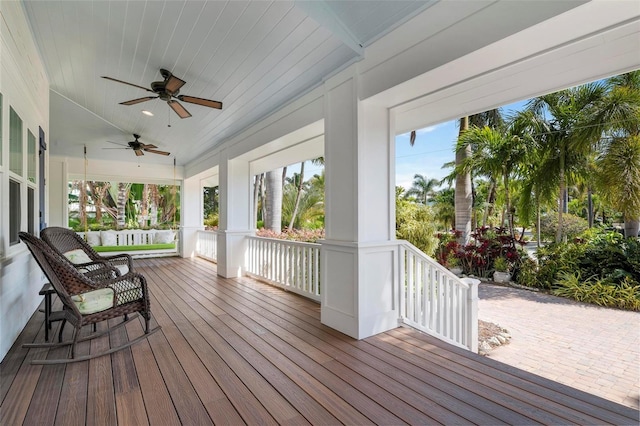 wooden terrace featuring ceiling fan and covered porch