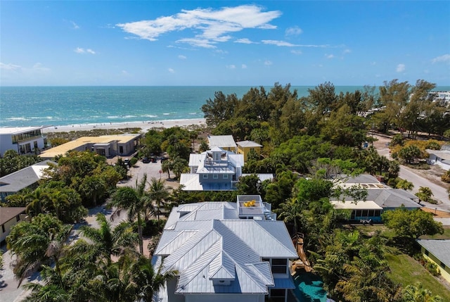 bird's eye view featuring a water view and a view of the beach