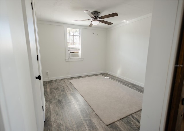 unfurnished room featuring ceiling fan, cooling unit, ornamental molding, and hardwood / wood-style flooring