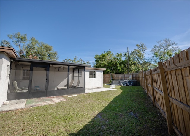 view of yard with a sunroom