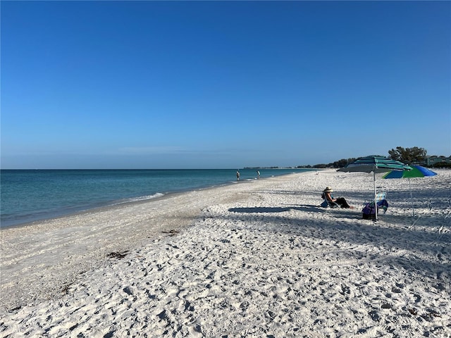 view of water feature with a beach view