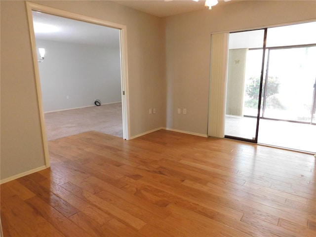 spare room featuring light wood-type flooring