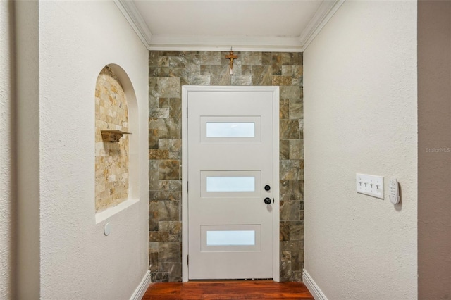 doorway to outside with crown molding and wood-type flooring