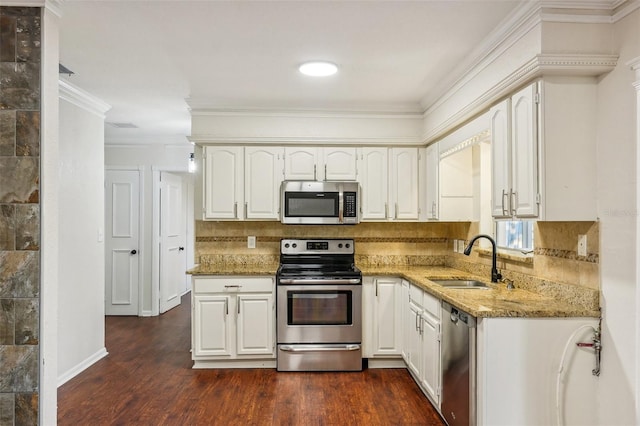 kitchen with dark hardwood / wood-style floors, sink, white cabinetry, and stainless steel appliances