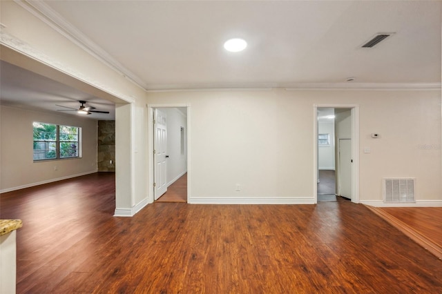 unfurnished room with ceiling fan, dark hardwood / wood-style flooring, and ornamental molding