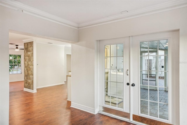 doorway featuring crown molding, french doors, ceiling fan, and wood-type flooring