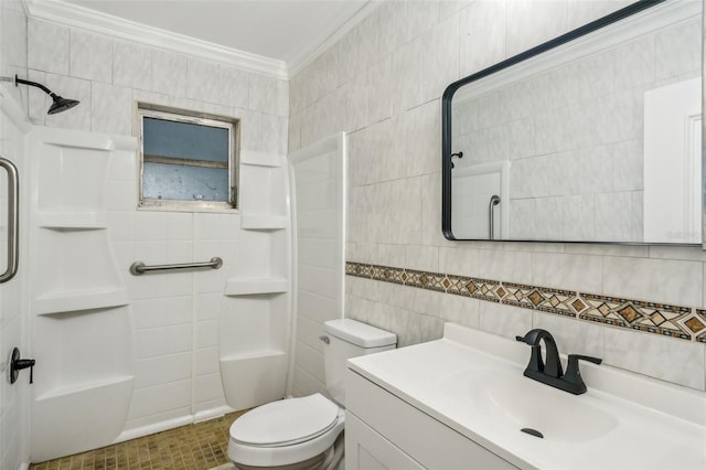 bathroom with vanity, toilet, ornamental molding, tile walls, and walk in shower