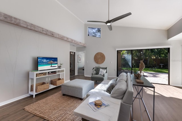 living room featuring ceiling fan, high vaulted ceiling, dark wood-type flooring, and ornamental molding