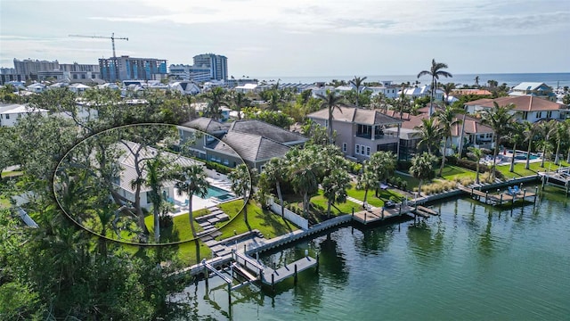 birds eye view of property featuring a water view