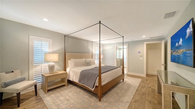 bedroom with light hardwood / wood-style flooring