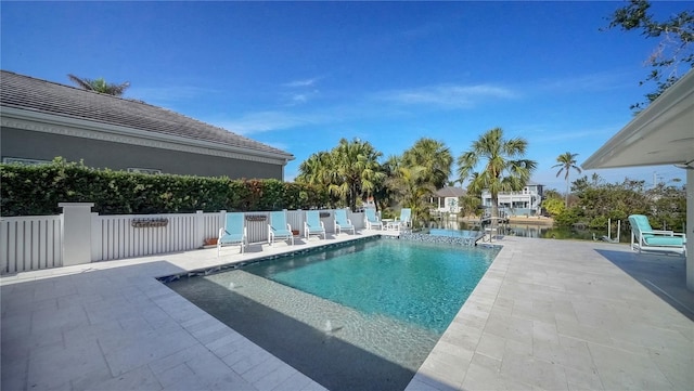 view of swimming pool featuring a patio area