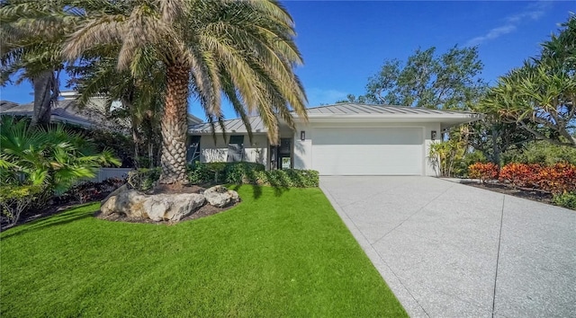 ranch-style house with a garage and a front yard