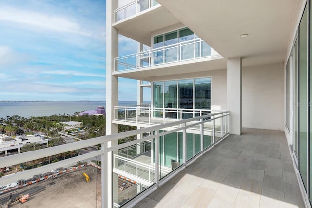 balcony featuring a water view